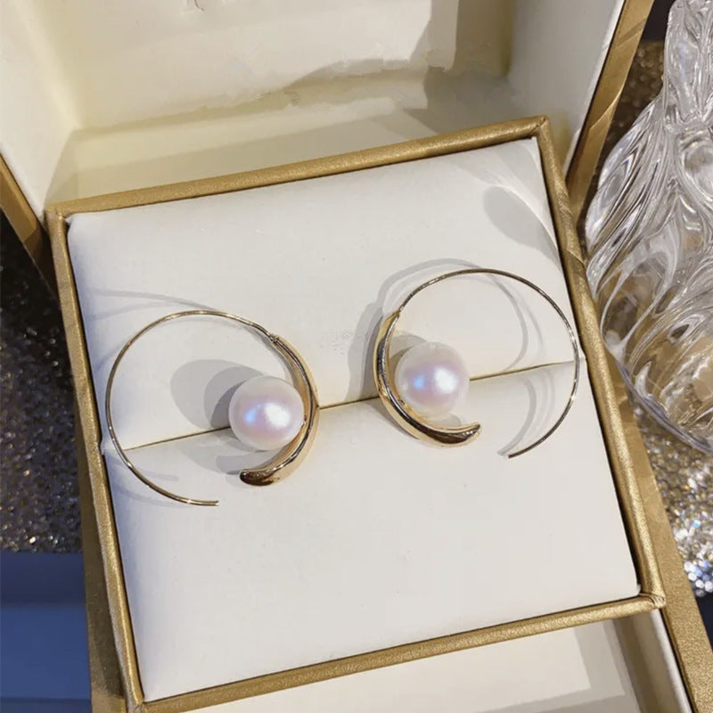 Large hoop pearl earrings