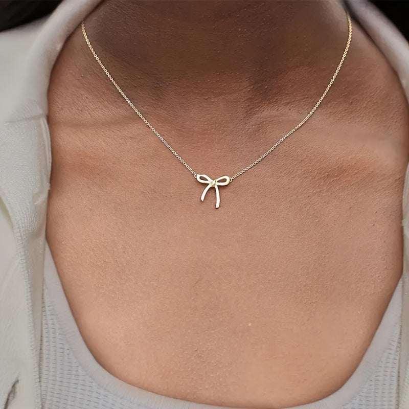 CharmKnot Delicate Gold Bow Necklace with Sophisticated Spark