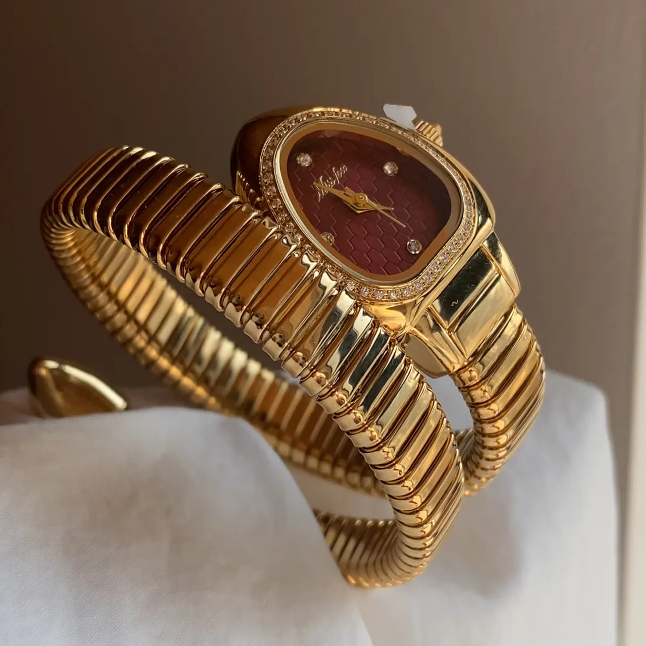 Golden Serpenti Timepiece – Red Dial and Diamond-Set Gold Bracelet