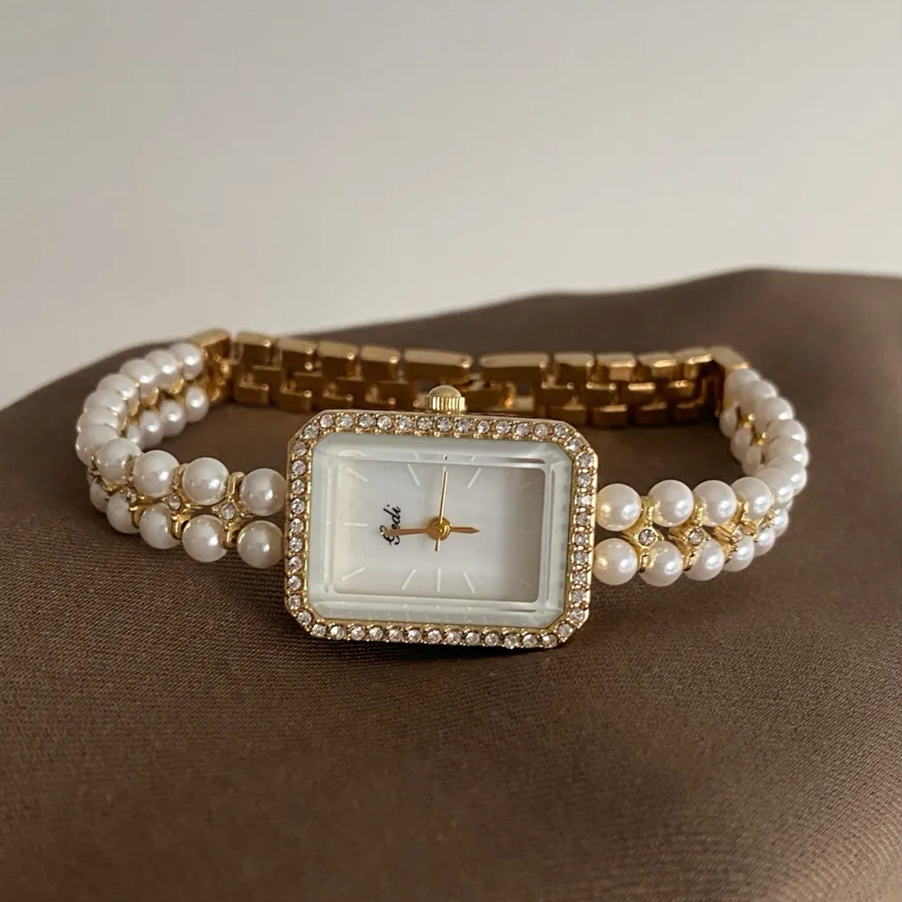 Chanel Charm Timepiece – Gold Mini Watch on Pearl-Linked Chain