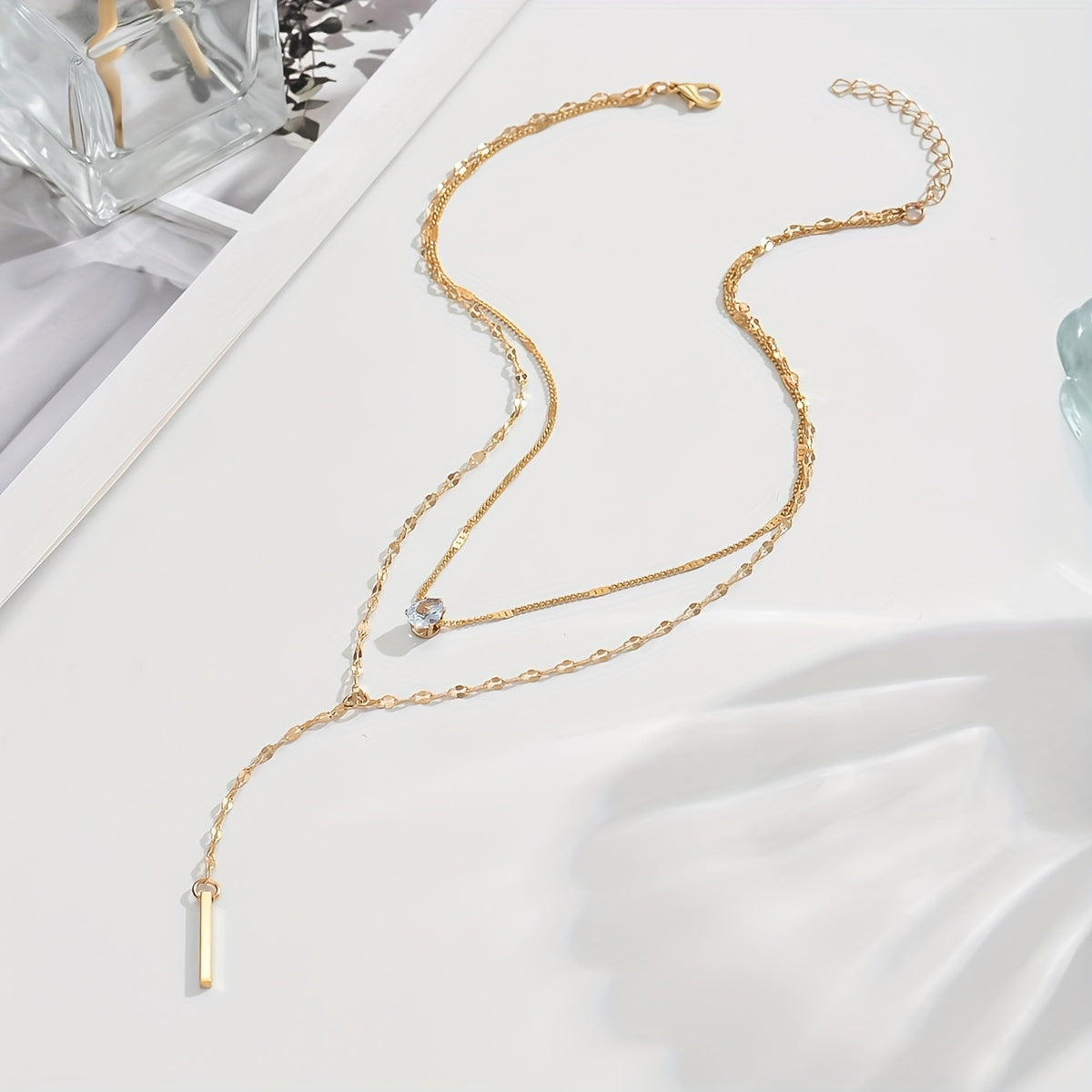 Golden Multi-Strand Pendant Necklace with Sparkling Rhinestone Accents