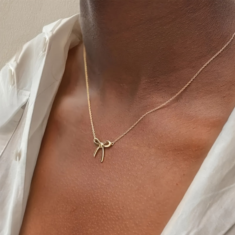 CharmKnot Delicate Gold Bow Necklace with Sophisticated Spark