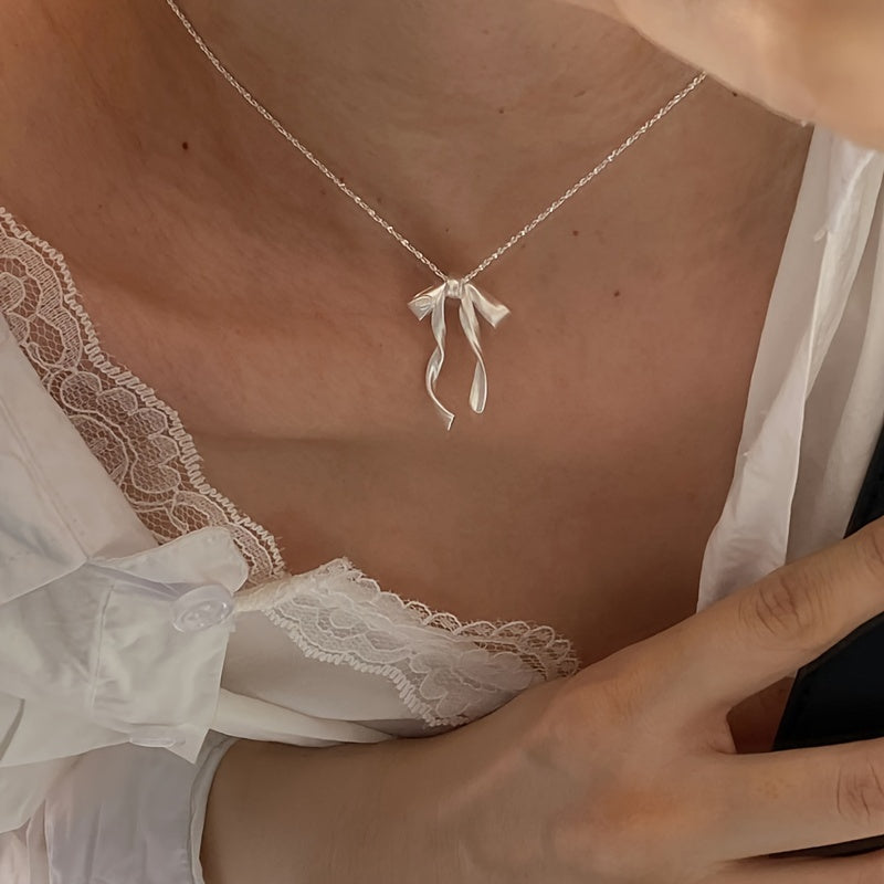 Elegant Ribbon Bow Pendant Necklace with Synthetic Stone