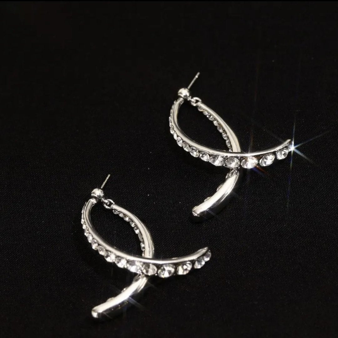 Fishtail Grace: Gold Statement Earrings