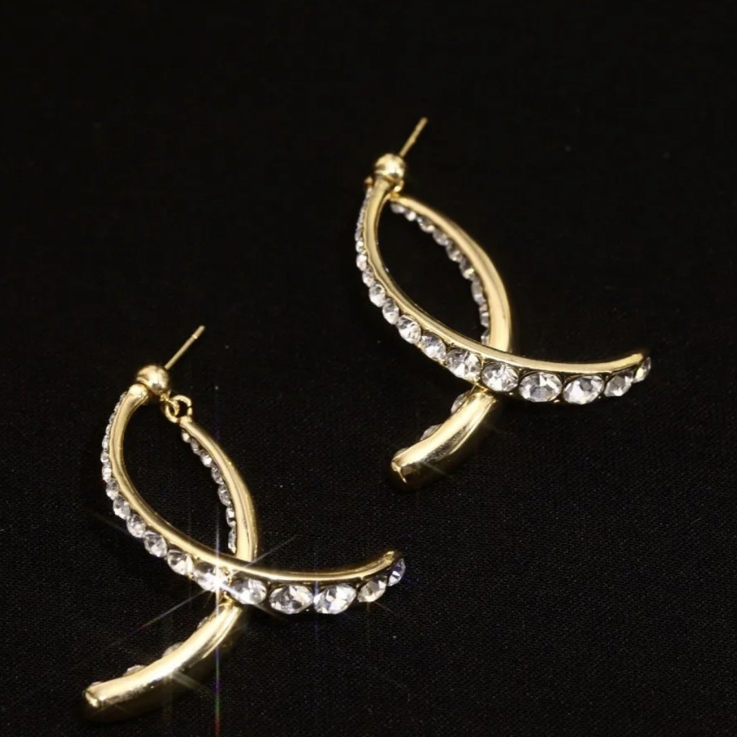 Fishtail Grace: Gold Statement Earrings
