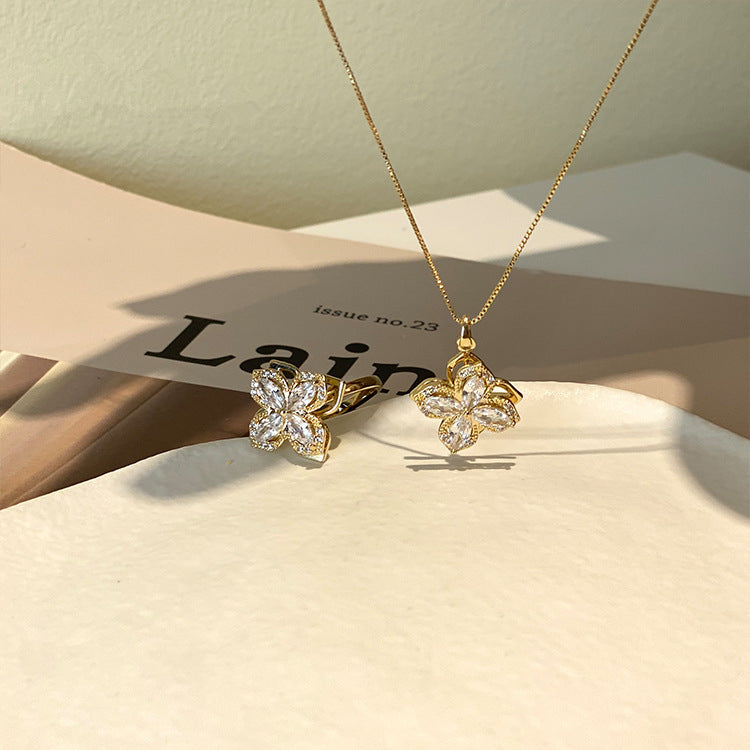 Rotating Clover Four Zirconia Ring & Necklace