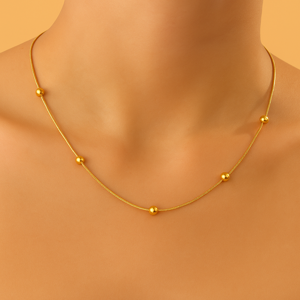 Refined snakebone necklace - Gold bead detail