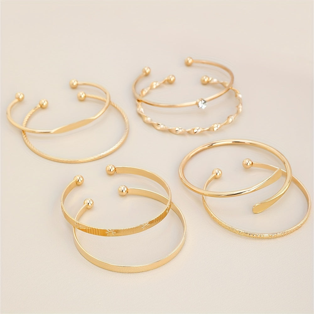 Elegant 8-Piece Gold Bangle Set – Twisted & Carved Designs with Rhinestones