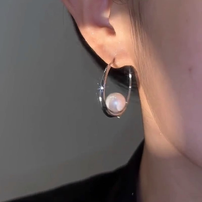 Large hoop pearl earrings