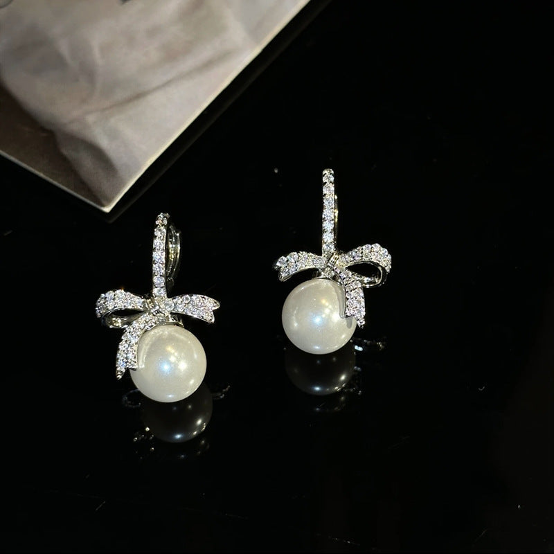Zirconia bow pearl earrings