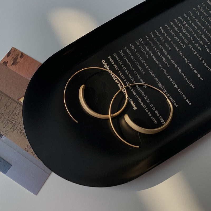 Large curved earrings