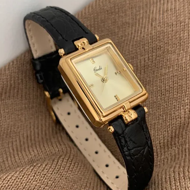 French Elegance Timepiece – Gold Dial Watch with Black Leather Band