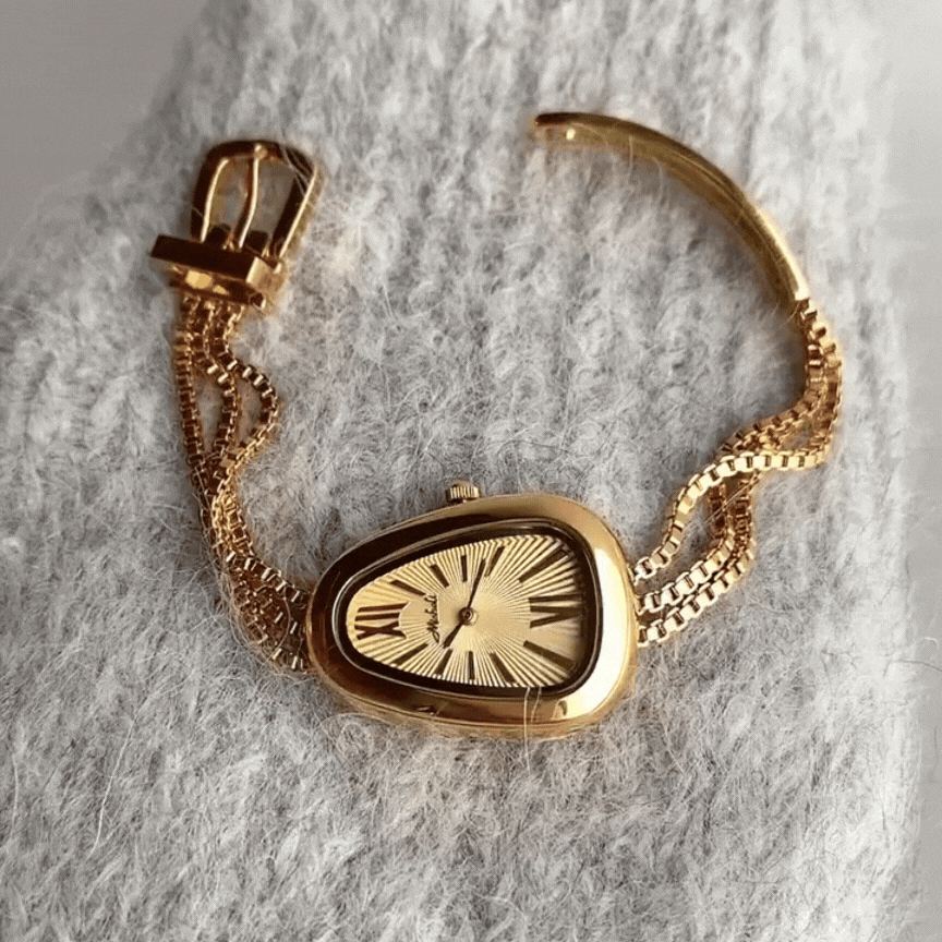 Golden Serpenti Timepiece – Quartz Watch with Steel Tassel Chain Design