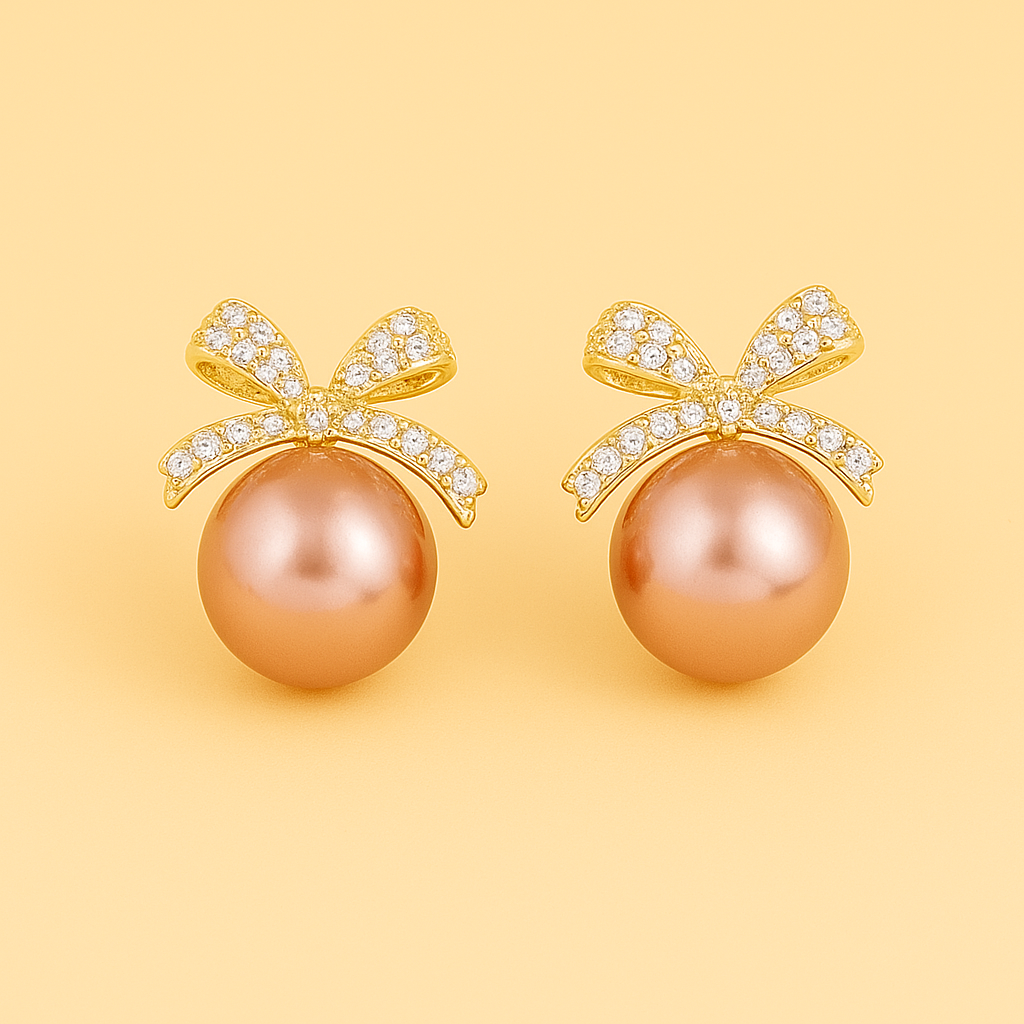 Ornate pearl earrings with bow embellishment