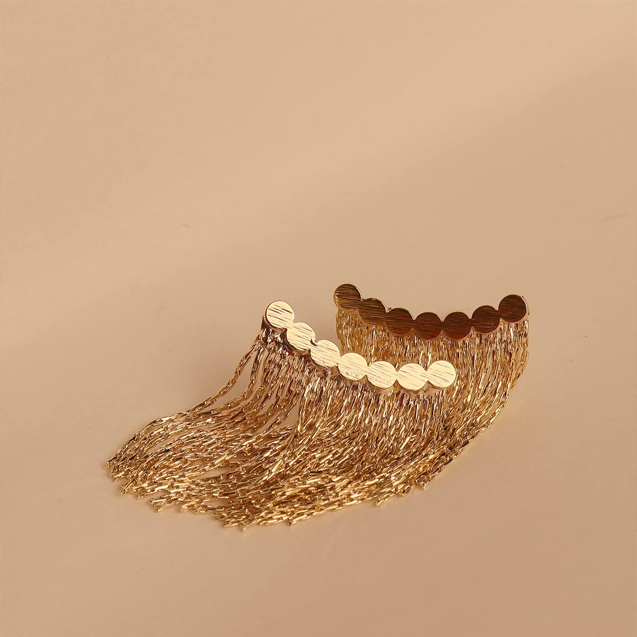 Long earrings with curved bar and tassel