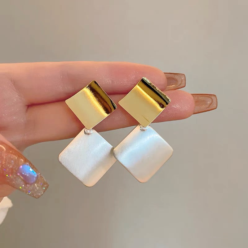 Square clashing earrings