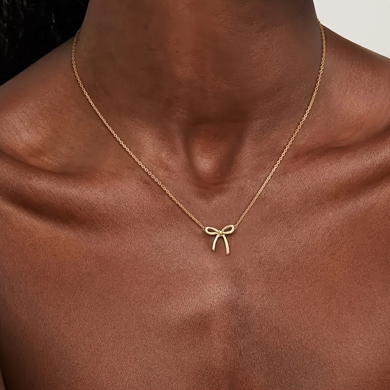 CharmKnot Delicate Gold Bow Necklace with Sophisticated Spark