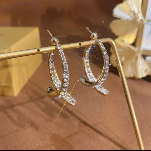 Fishtail Grace: Gold Statement Earrings