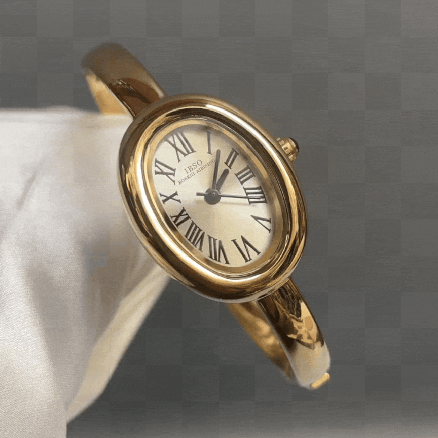 Aura Curve: Sculpted Oval Dial Bangle Watch in Gold