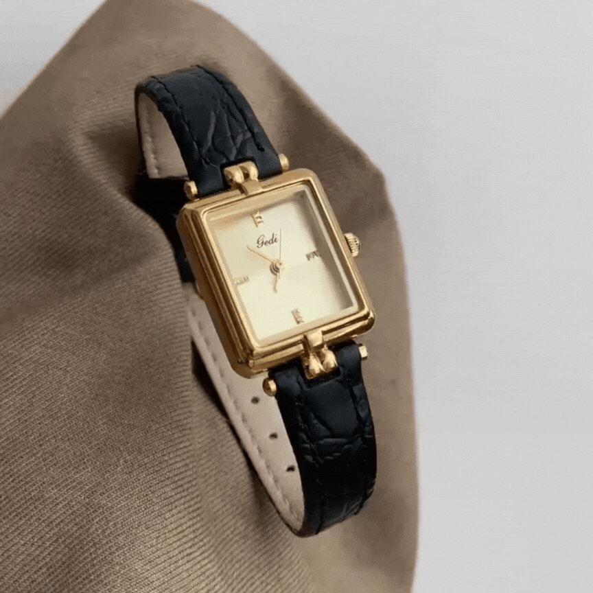 French Elegance Timepiece – Gold Dial Watch with Black Leather Band