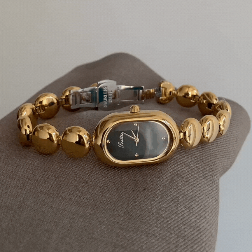 Gold Oval Quartz Watch for Women – Black Dial & Beaded Bracelet Design